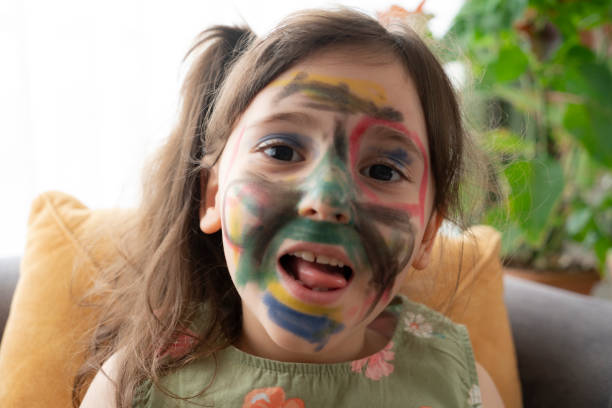 istock Smiling little girl with a painted face 1330248396