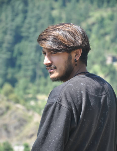 istock A handsome north Indian young guy standing outdoor with looking back 1330249418