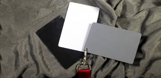 Grey card with a red strap, a photographer’s tool, determining the correct white balance
