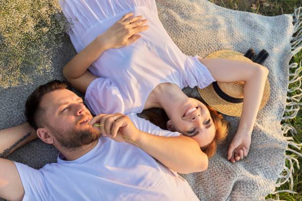 istock Happy middle aged couple, top view on smiling faces 1330250834