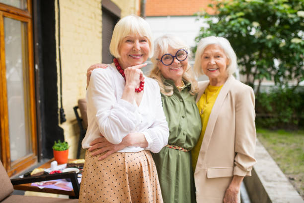 istock Three ssweet senior ladies looking happy spedning time together 1330250910