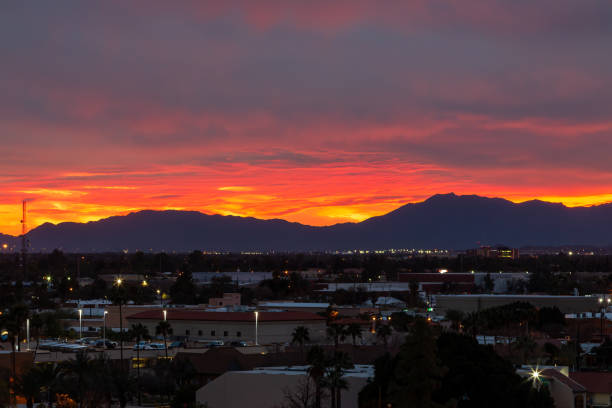 Estrella Mountain and downtown Phoenix, AZ under a rare cloudy red sunset