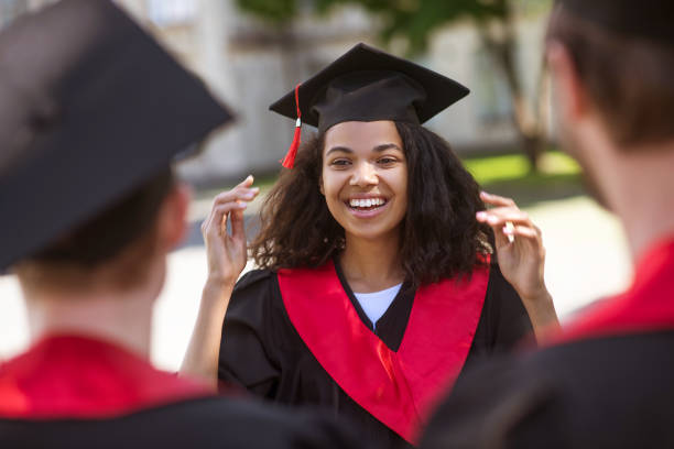 istock Graduates from colleges feeling happy and smiling nicely 1330256792