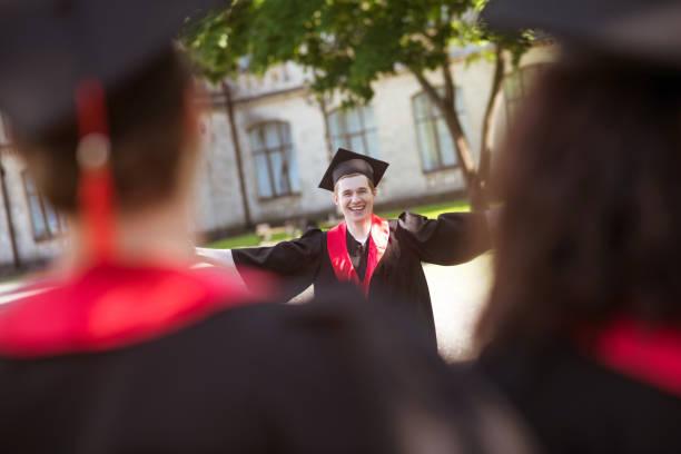 istock Graduates from colleges feeling happy and smiling nicely 1330256794