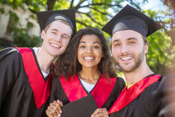 istock A group of graduates spending time together and feeling united 1330256804