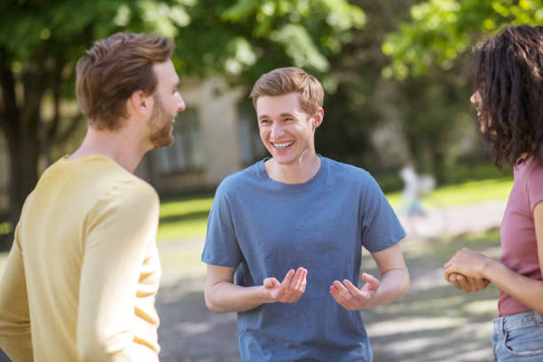 istock Three friends spending time together and smiling nicely 1330256820