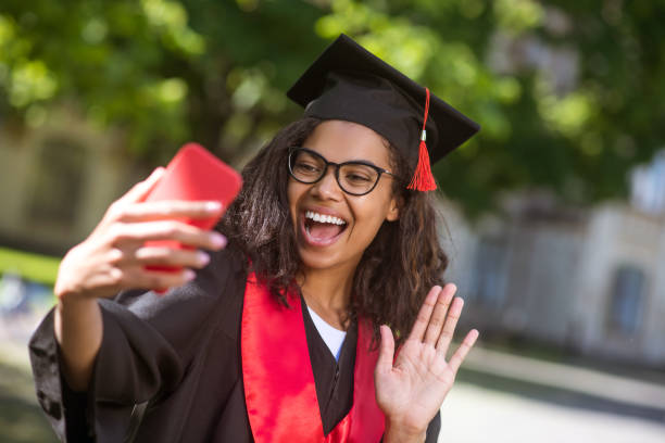 istock Young graduate feeling happy and excited on a video call 1330257005