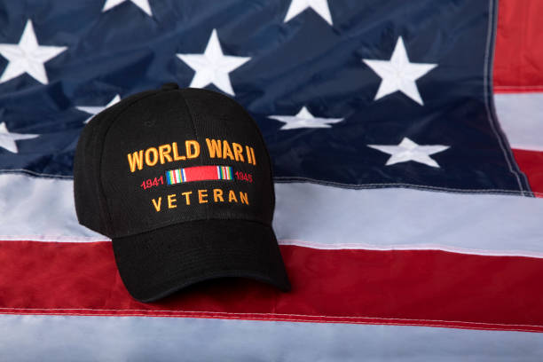 istock World War Two Veterans cap with American Flag background 1330257730