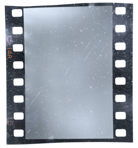istock 35mm film or movie strip with empty frame on white. 1330258018