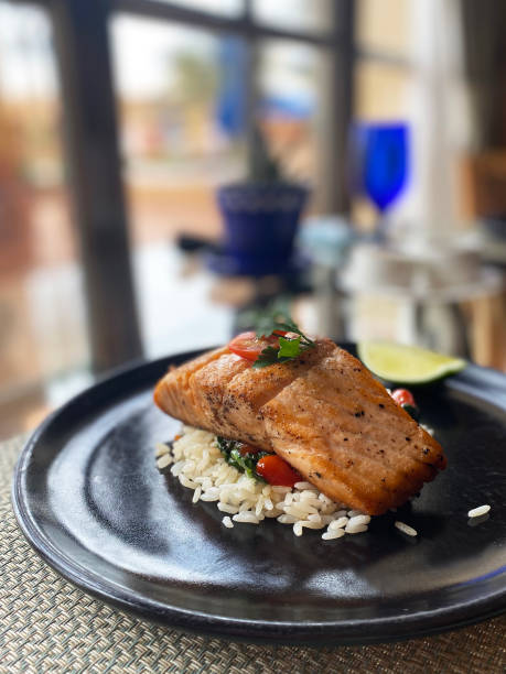 istock Cancun, Mexico - May 23, 2021: Salmon with rice for meal. 1330258271