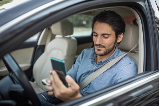 istock Young man in car 1330261747