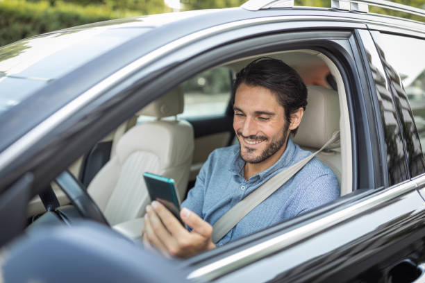 istock Young man in car 1330261763