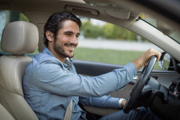 istock Young man in driving car 1330262373