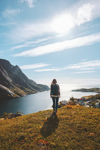 Tourist woman walking alone outdoor travel summer vacations lifestyle girl on tour in Norway