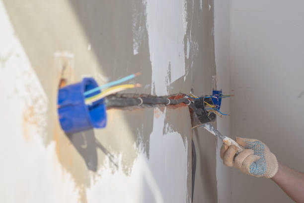 istock A Caucasian male builder secures an electrical box under an outlet with plaster or alabaster 1330263835