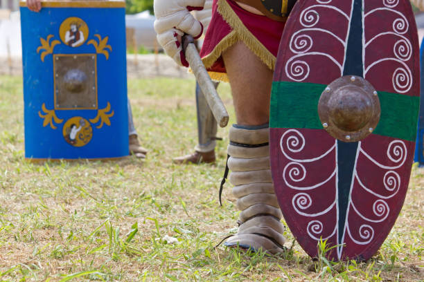 Painted Shields Carried by Gladiators Aquileia, Italy - June 22, 2014: Painted battle shields carried by ancient gladiators at the local historical reenactment gladiator shoe stock pictures, royalty-free photos & images