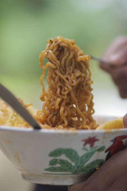 istock Instant noodle on white bowl and blurred background 1330271650