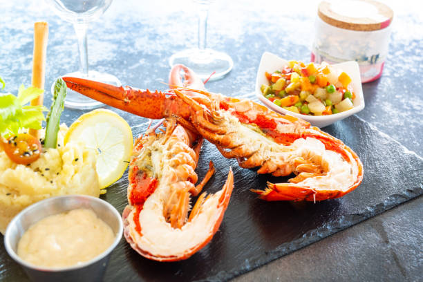 istock Lobster cut in half presented on a slate 1330271930
