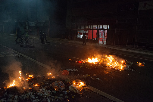 Debris burning at night after a demonstration