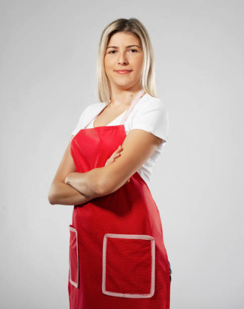istock Strong blonde woman with red apron 1330280584