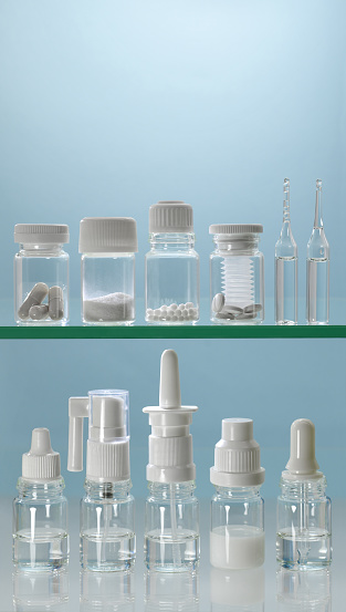 Shelves with different forms of medicines are white on a blue background.