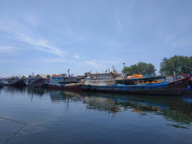 istock traditional wooden boat leaning on the harbor 1330286134
