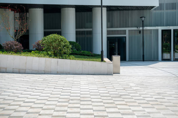 istock empty concrete ground floor in front of modern building. 1330286202