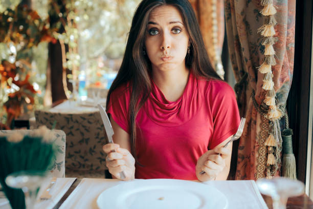 istock Stressed Woman Having a Pill Before the Meal in a Restaurant 1330286835