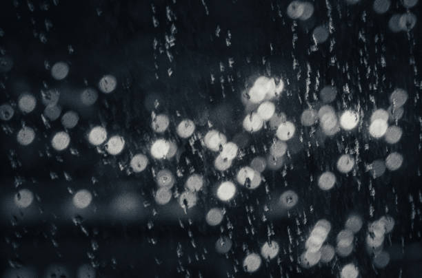 istock rain on the window and christmas light while cozy in home 1330288285