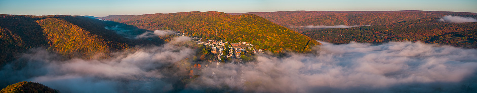 The low clouds on a sunny morning in the Pocono Mountains over Jim Thorpe town, Pennsylvania, Carbon County, USA.