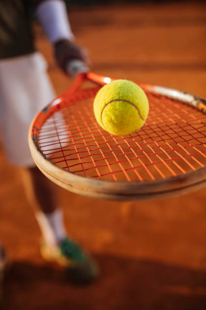 I am ready, are you? Unrecognisable man holding his tennis racket and ball outdoors clay court stock pictures, royalty-free photos & images