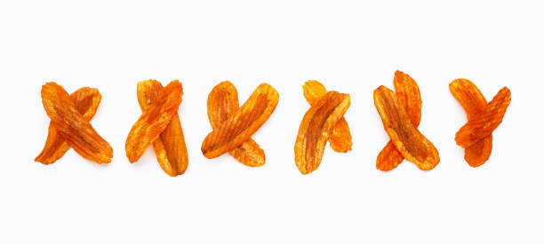 istock Spicy snack, Banana slice chips paprika flavor on white background. 1330291375