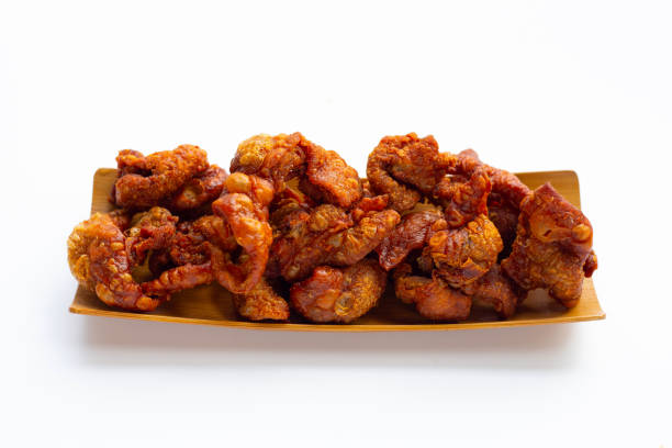 istock Chispy fried chicken skin on white background. 1330291959