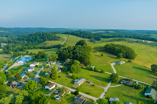 An aerial establishing view of the small Bentleyville town villages on the hills of Pennsylvania US
