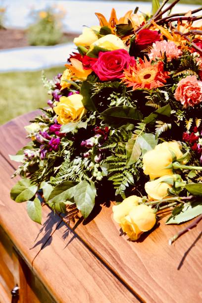 istock Beautiful floral arrangement on wooden casket 1330299540