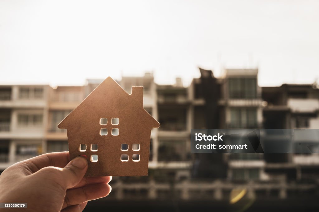 House model in home insurance broker agent ‘s hand or in salesman person. Real estate agent offer house, property insurance and security, affordable housing concepts Affordable Housing Stock Photo