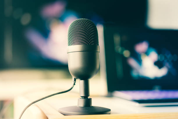 Microphone with laptop live video and working at home concept stock photo