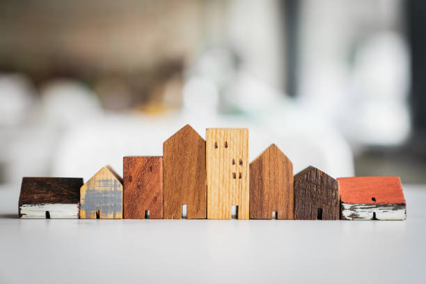 house model on wood table. real estate agent offer house, property insurance and security, affordable housing concepts - inheritance tax imagens e fotografias de stock