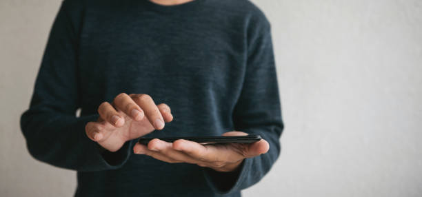 istock Man using cellphone for searching data and social media on internet. 1330305578