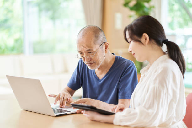 istock Elderly people who are taught how to use a computer at a long-term care facility 1330305585
