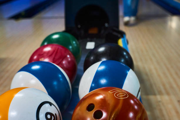 istock bowling balls in a bowling machine in a game room 1330313585