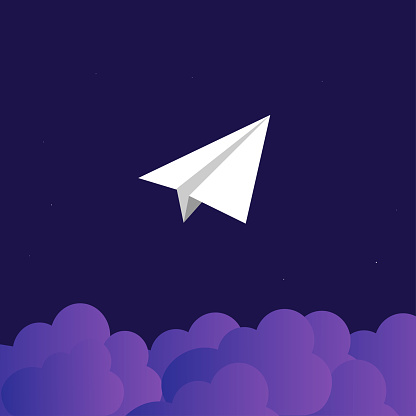 A lone paper plane soars over purple clouds into the starry night.