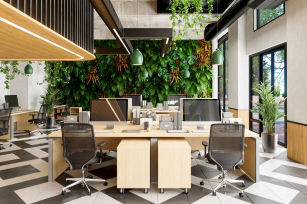 istock Eco-Friendly Open Plan Modern Office With Tables, Office Chairs, Plants And Vertical Garden Background 1330315808