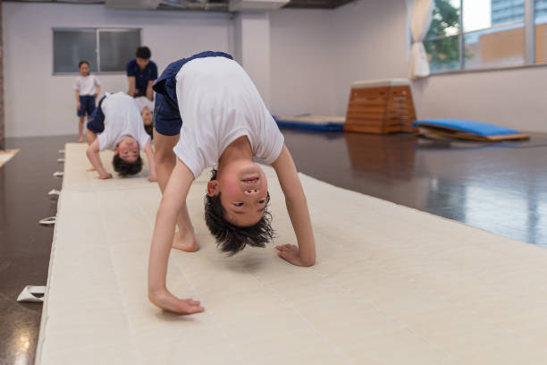 Gymnastics school for Japanese children A scene where Japanese children aged 5 to 10 are practicing gymnastics artistic gymnastics stock pictures, royalty-free photos & images