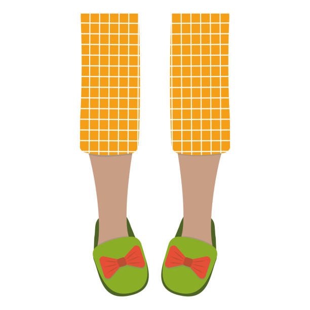 Legs of girls in pajamas and slippers, color isolated vector illustration in the flat style Legs of girls in pajamas and slippers, color isolated vector illustration in the flat style. woman feet bed stock illustrations