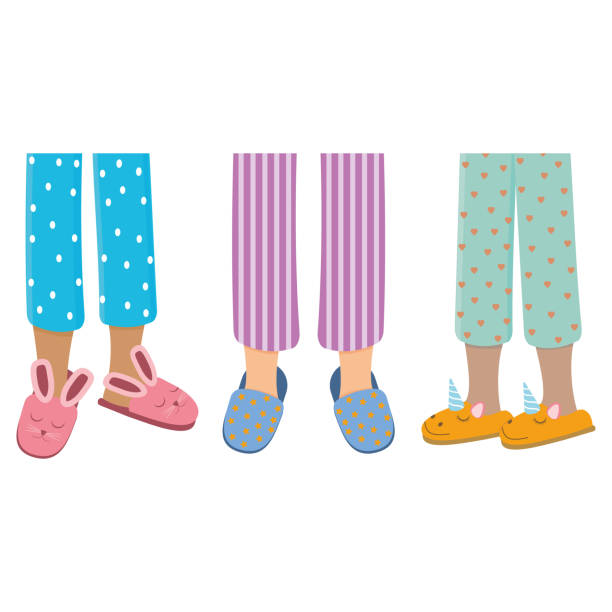 Legs of girls in pajamas and slippers, color isolated vector illustration in the flat style Legs of girls in pajamas and slippers, color isolated vector illustration in the flat style. woman feet bed stock illustrations