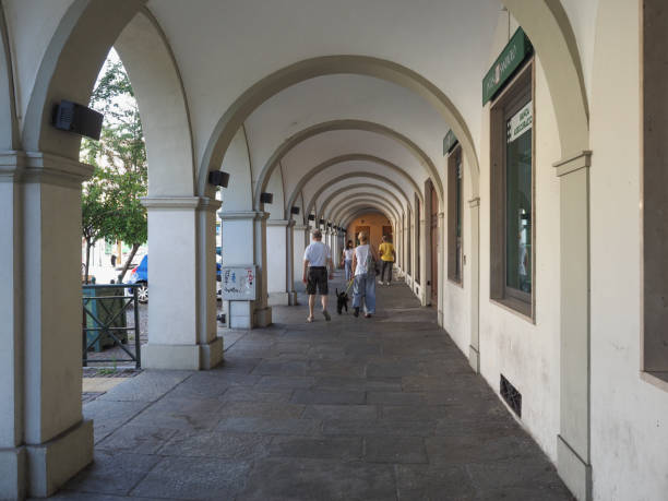 SAN MAURO, ITALY - CIRCA JULY 2021: Colonnade portico in the city centre. Some people visible