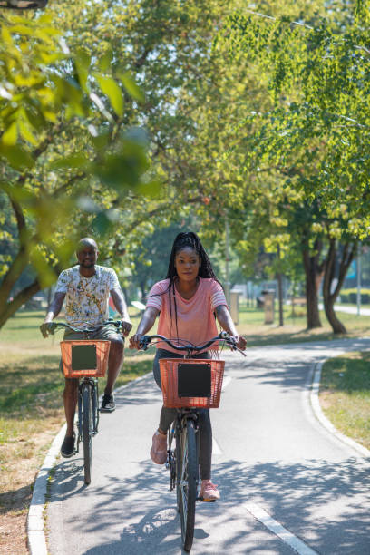 istock Couple Riding Bicycle Together 1330325309