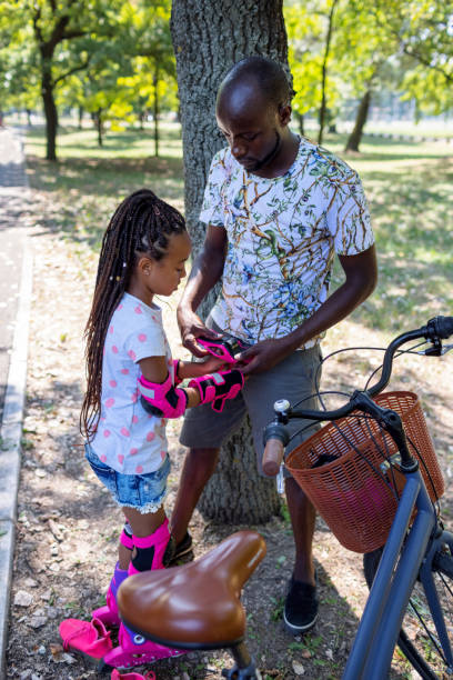 istock Cute Black Girl Learning To Skate 1330326070