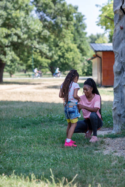 istock Mother Securing Her Daughter In Harness 1330326376